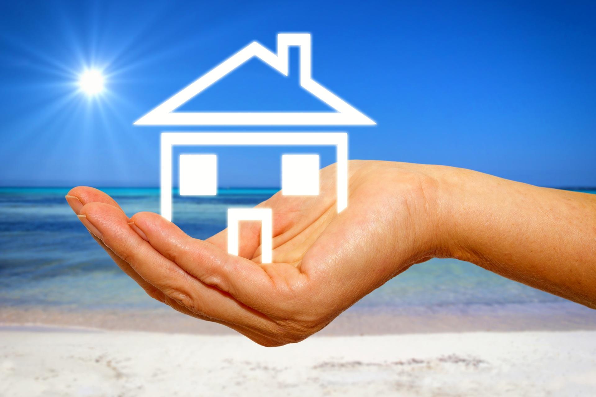 Haussymbol am Strand in Handfläche | Luxusvilla in Dubai kaufen

